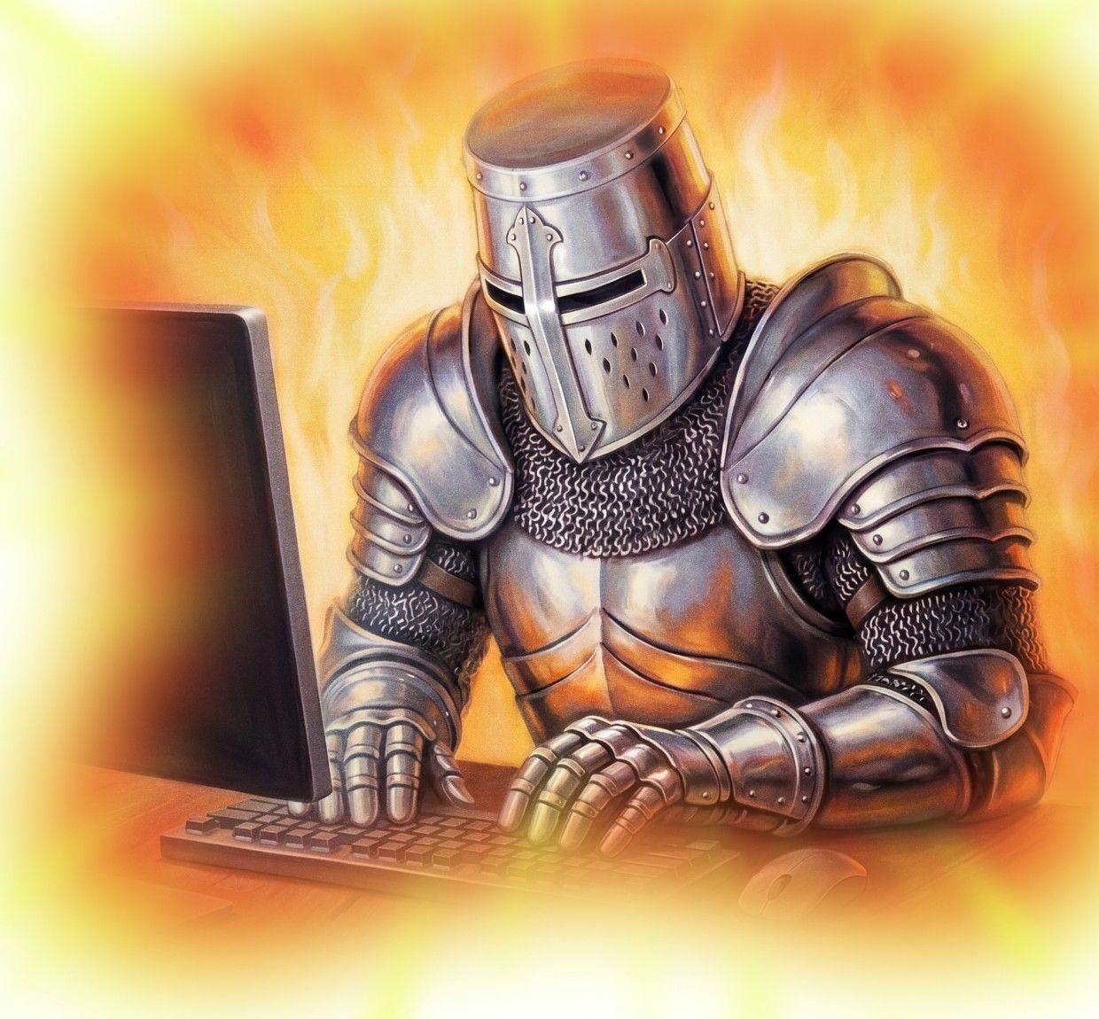 A knight in full armour typing at a computer, surrounded by fire